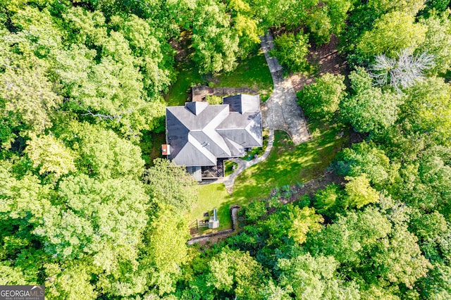 birds eye view of property with a wooded view