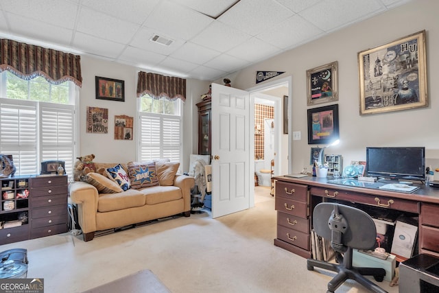 carpeted office featuring visible vents, a wealth of natural light, and a paneled ceiling