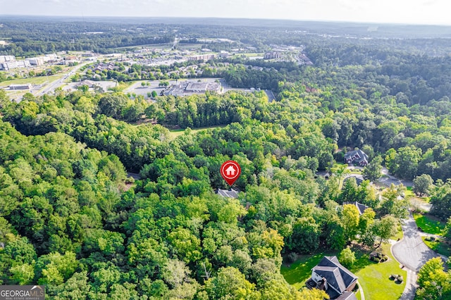 drone / aerial view with a view of trees