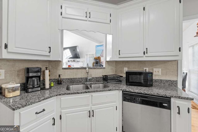 kitchen featuring light wood-type flooring, light stone counters, white cabinetry, sink, and stainless steel dishwasher