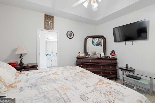 bedroom featuring carpet, ceiling fan, and ensuite bathroom