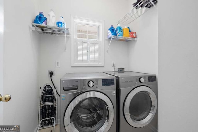 laundry area with washing machine and dryer