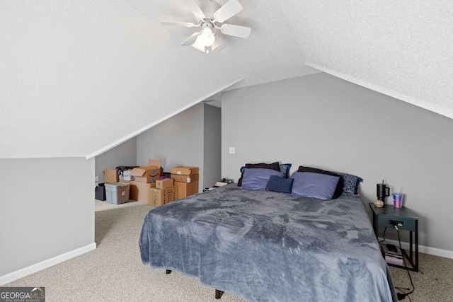 bedroom featuring ceiling fan, carpet floors, and vaulted ceiling