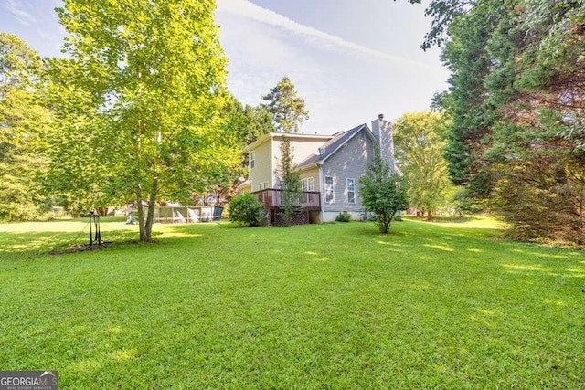 view of yard featuring a deck