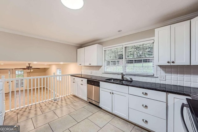 kitchen featuring white cabinets, stainless steel dishwasher, and sink