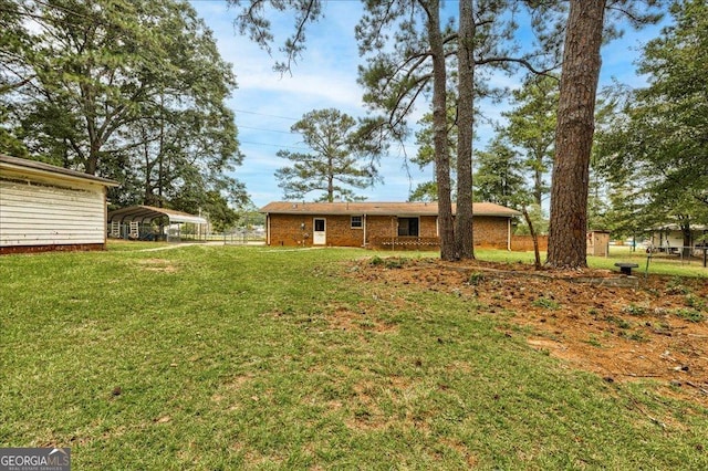 view of yard featuring a carport