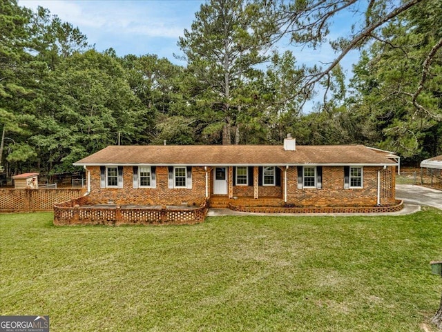 single story home featuring a front lawn