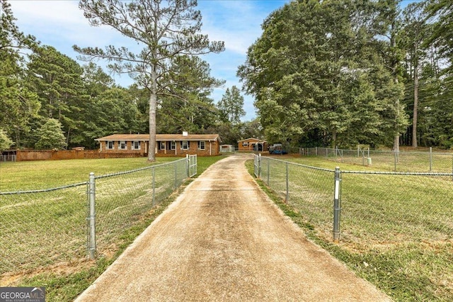 view of front of house featuring a front yard and a rural view