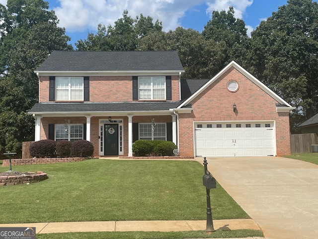 view of front facade featuring a garage and a front lawn