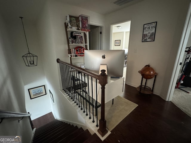 stairs with hardwood / wood-style floors