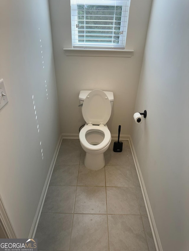 bathroom featuring tile patterned flooring and toilet