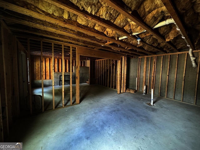 misc room with concrete flooring