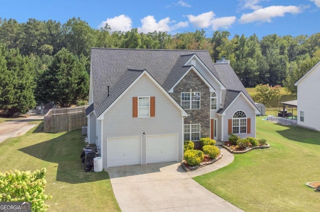 front of property featuring a front lawn and a garage