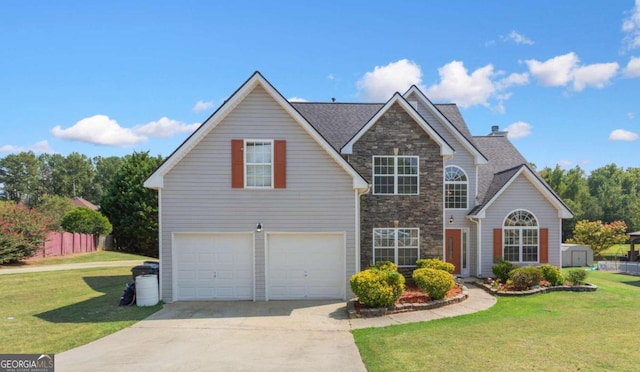 view of front property with a front yard and a garage