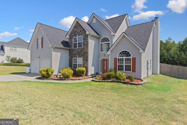 front facade featuring a front yard and a garage