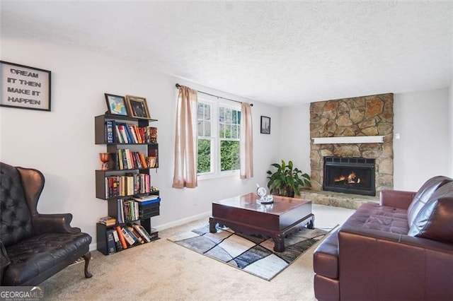 living room with carpet, a stone fireplace, and a textured ceiling