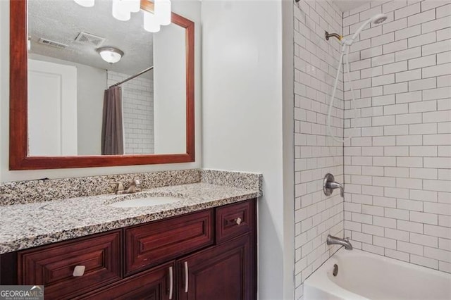 bathroom with vanity and shower / bath combination with curtain