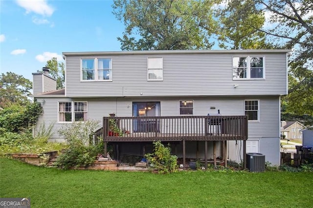 rear view of property with central AC, a yard, and a deck