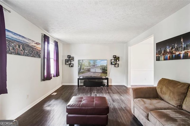 living room with hardwood / wood-style floors and a textured ceiling