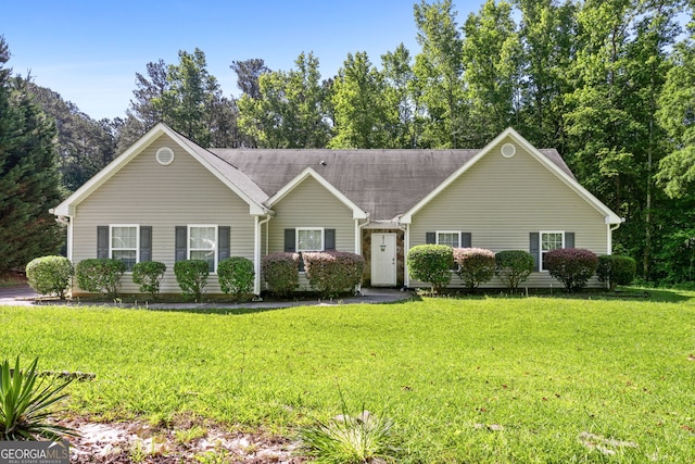 ranch-style house featuring a front lawn