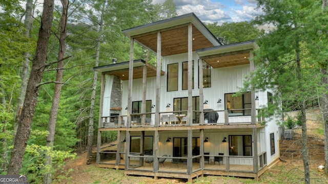 back of house featuring a balcony