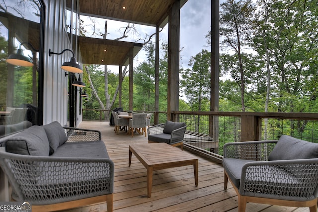 wooden terrace featuring outdoor lounge area