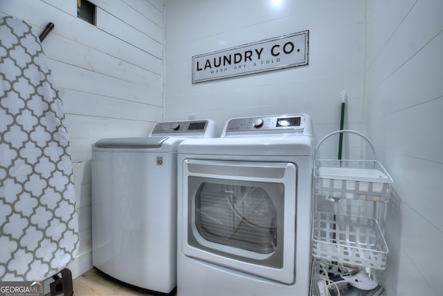 clothes washing area featuring washing machine and dryer