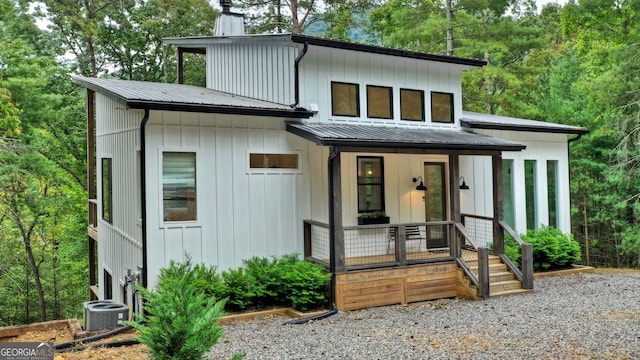 view of front facade with central AC and covered porch