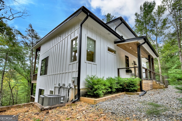 view of property exterior with central AC