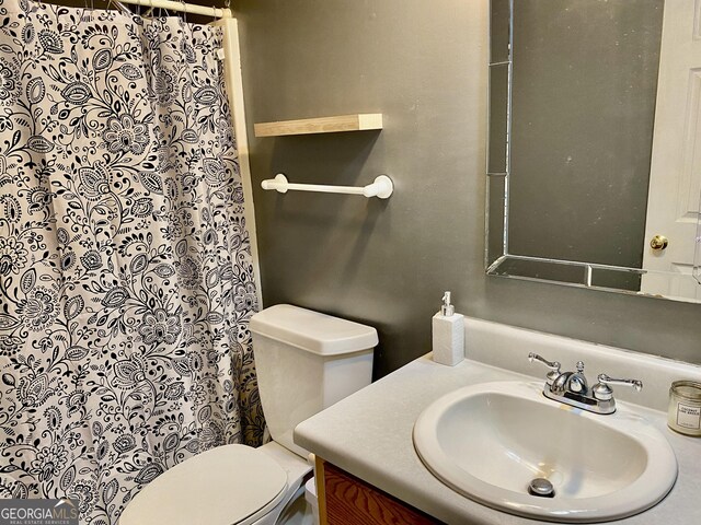 1832 Wayside Rd, Kingston, GA 30145 - full bathroom featuring vanity, toilet, and a shower with shower curtain