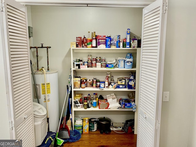 storage area featuring electric water heater