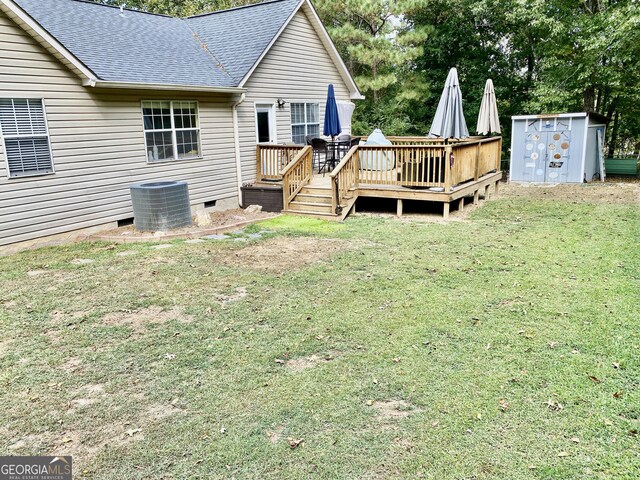 1832 Wayside Rd, Kingston, GA 30145 - view of yard with central AC, an outbuilding, a wooden deck, and a storage unit