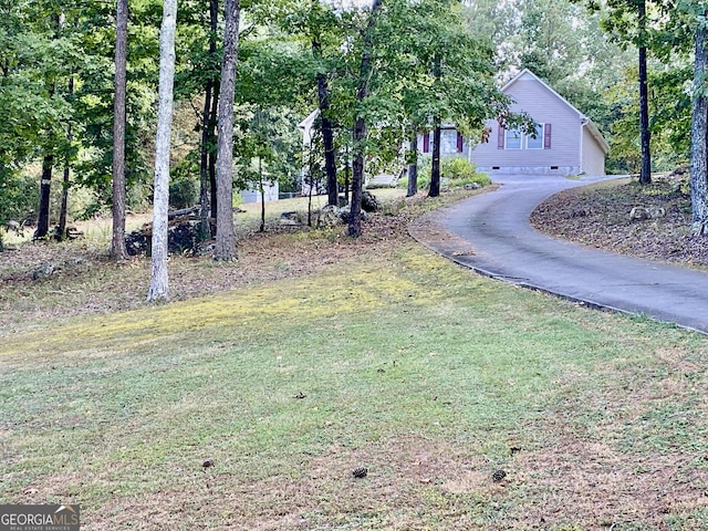 exterior space featuring aphalt driveway