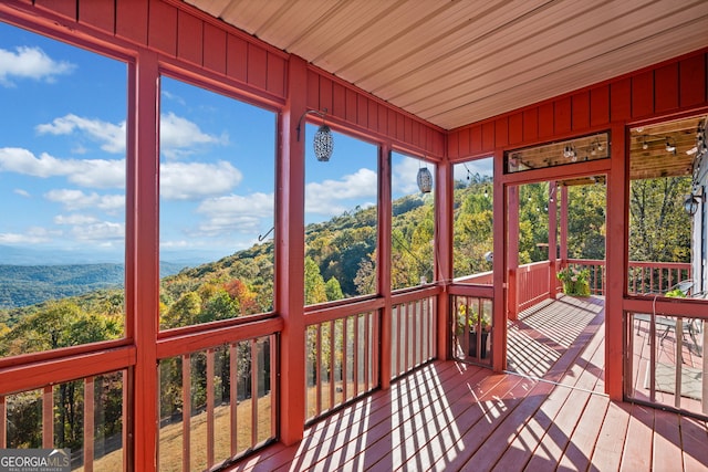 unfurnished sunroom featuring wooden ceiling