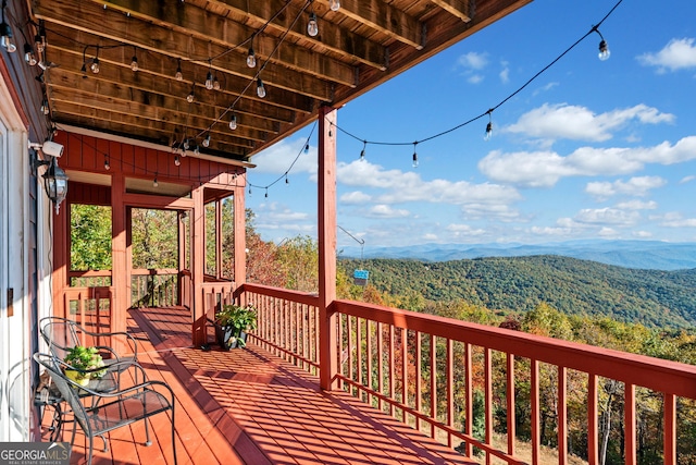 wooden terrace featuring a mountain view