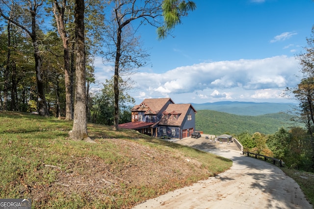 view of front of home featuring a mountain view and a garage