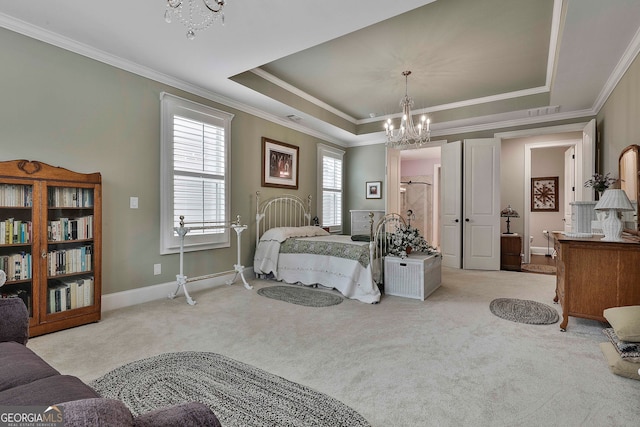 carpeted bedroom featuring a notable chandelier, a raised ceiling, and crown molding