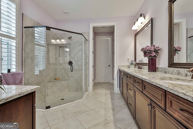 bathroom featuring vanity, tile patterned flooring, and an enclosed shower