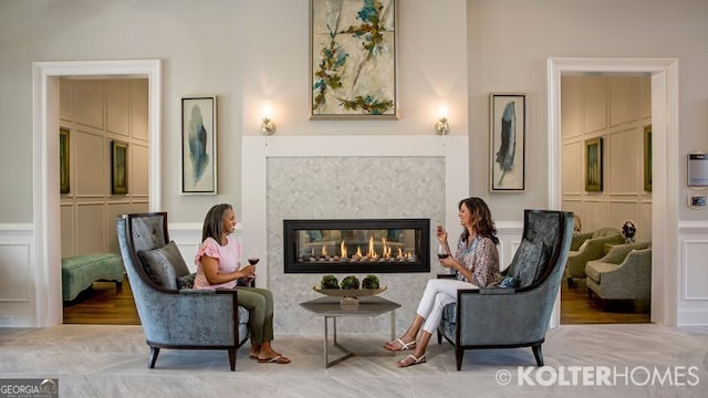 sitting room with hardwood / wood-style flooring