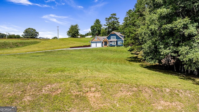 view of yard with a garage