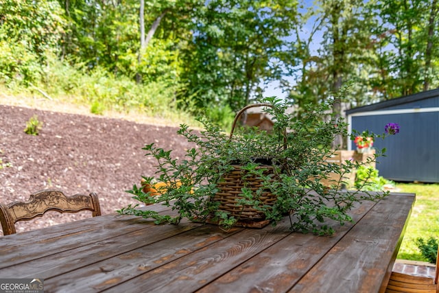 deck featuring a shed