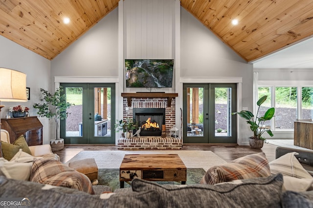 living room with french doors, wood-type flooring, wood ceiling, and high vaulted ceiling