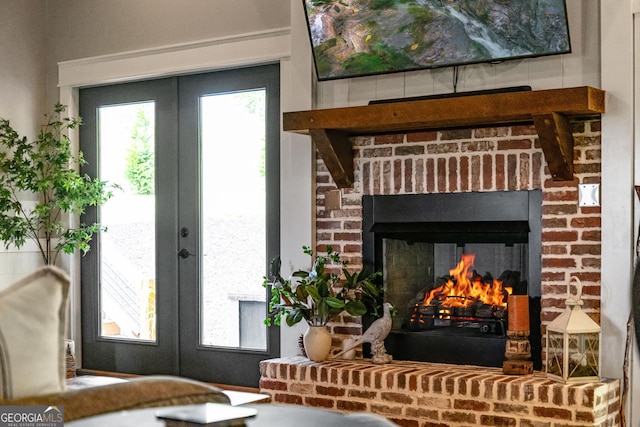 interior space featuring french doors and a fireplace