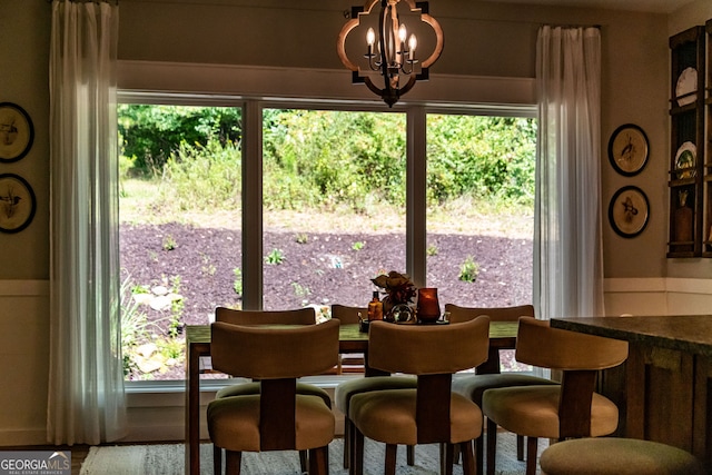 dining space with a notable chandelier and a wealth of natural light