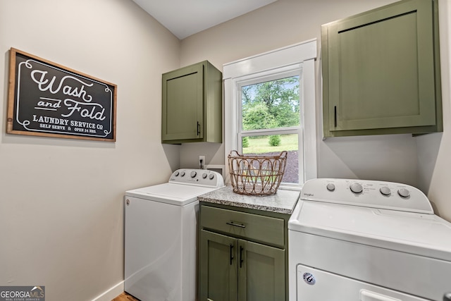 laundry area featuring cabinets and washer and dryer