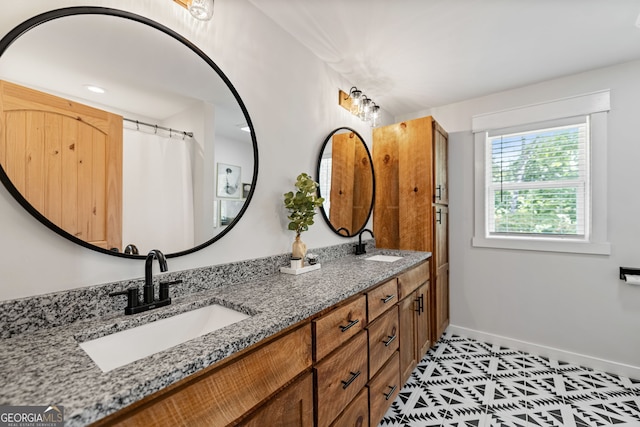 bathroom featuring vanity and tile patterned flooring