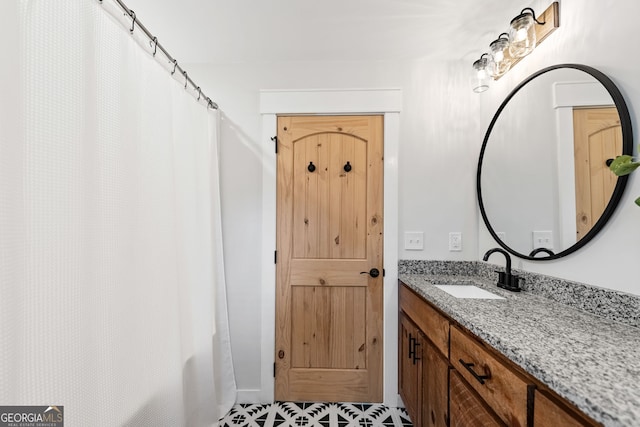 bathroom with a shower with shower curtain, tile patterned flooring, and vanity