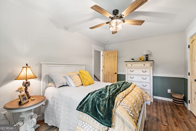 bedroom featuring ceiling fan and dark hardwood / wood-style flooring