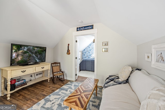 interior space featuring lofted ceiling and dark hardwood / wood-style floors