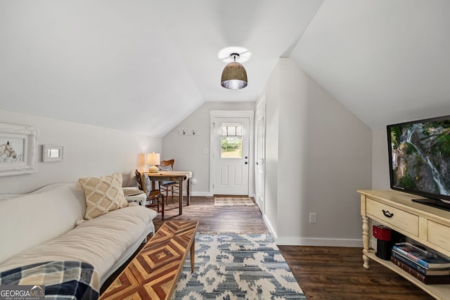 living room with lofted ceiling and dark hardwood / wood-style floors